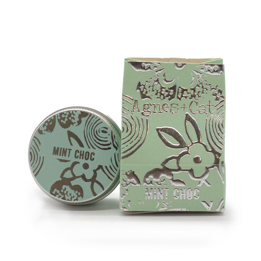 Mint green container and packaging with 'Agnes + Cat' branding on a white background