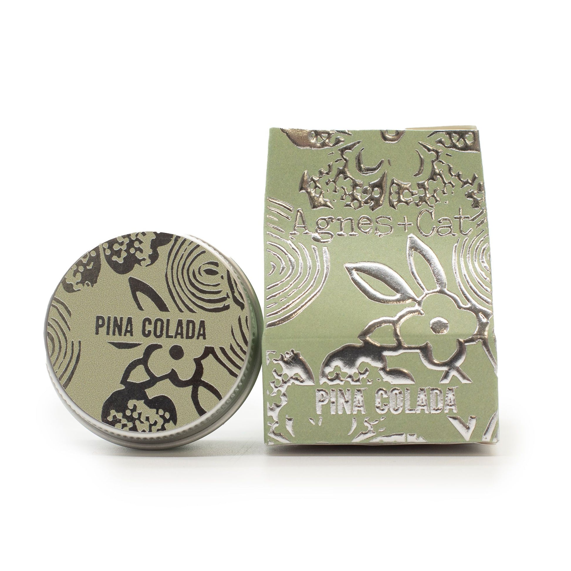 Green soap bar with 'Pina Colada' text and decorative design on a white background