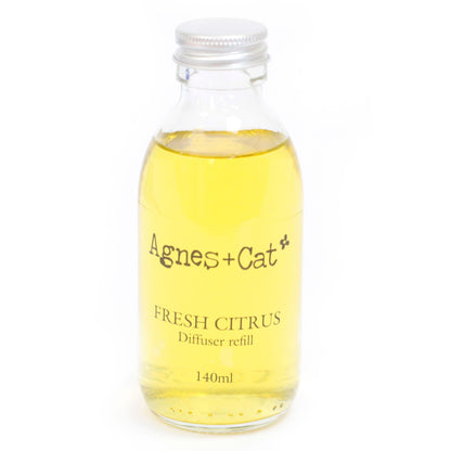Glass bottle of Agnes + Cat Fresh Citrus diffuser refill on a white background