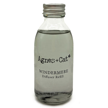 Glass diffuser refill bottle labeled 'Agnes + Cat Windermere' on a white background