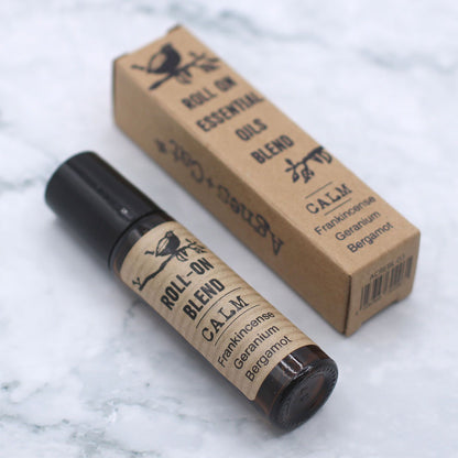 Roll-on blend bottle and box on a marble surface