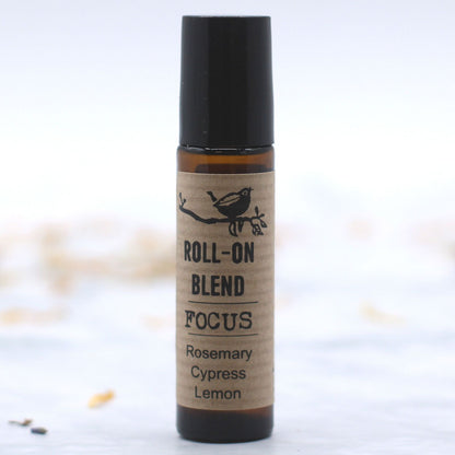 Roll-on blend labeled 'Focus' with ingredients on a white background