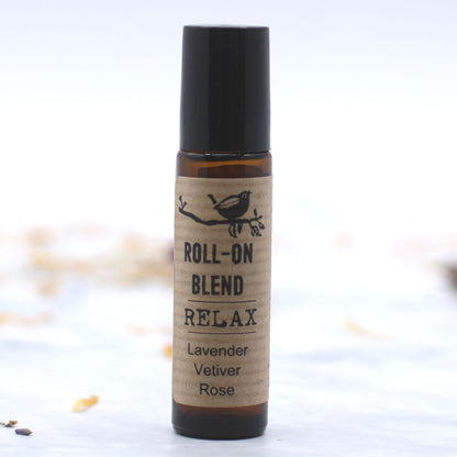Roll-on blend bottle labeled 'Relax' with ingredients on a white background