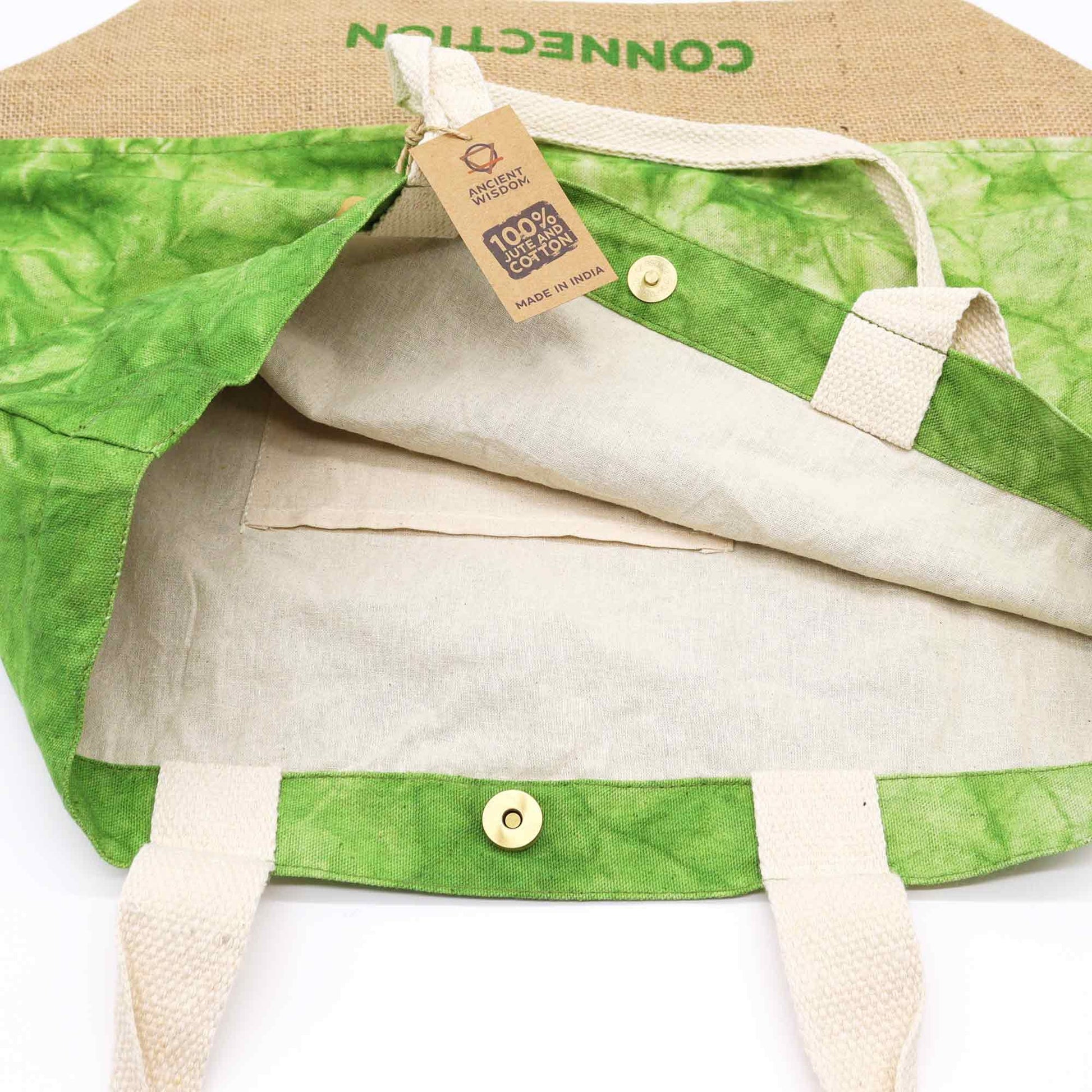 Green and beige fabric with a tag indicating 100% organic cotton on a white background