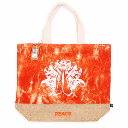 Tote bag with tie-dye design and 'PEACE' text on a white background