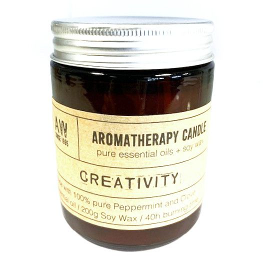 Aromatherapy candle labeled 'Creativity' with a white background
