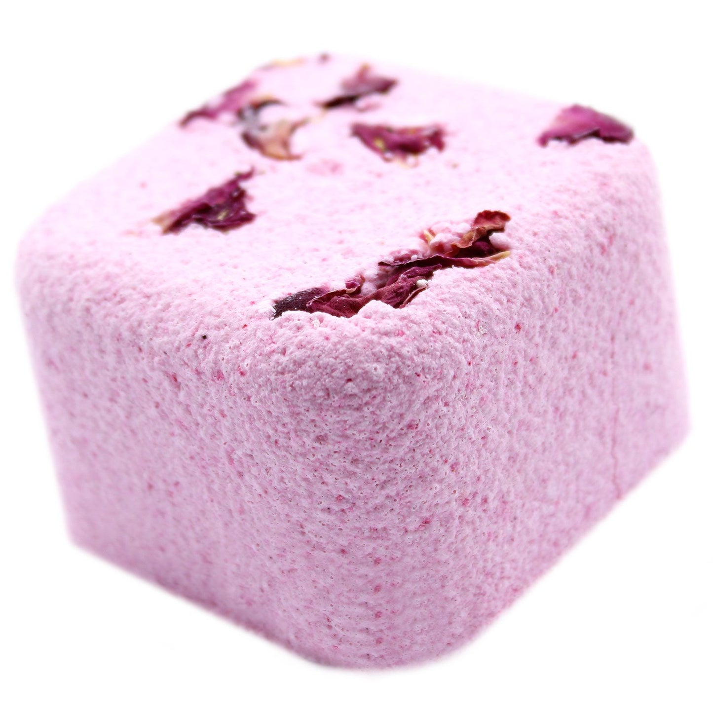 Pink bath bomb with rose petals on a white background