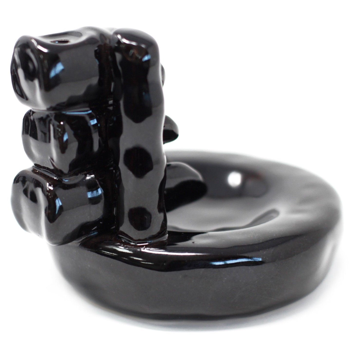 Black ceramic bear-shaped object on a white background