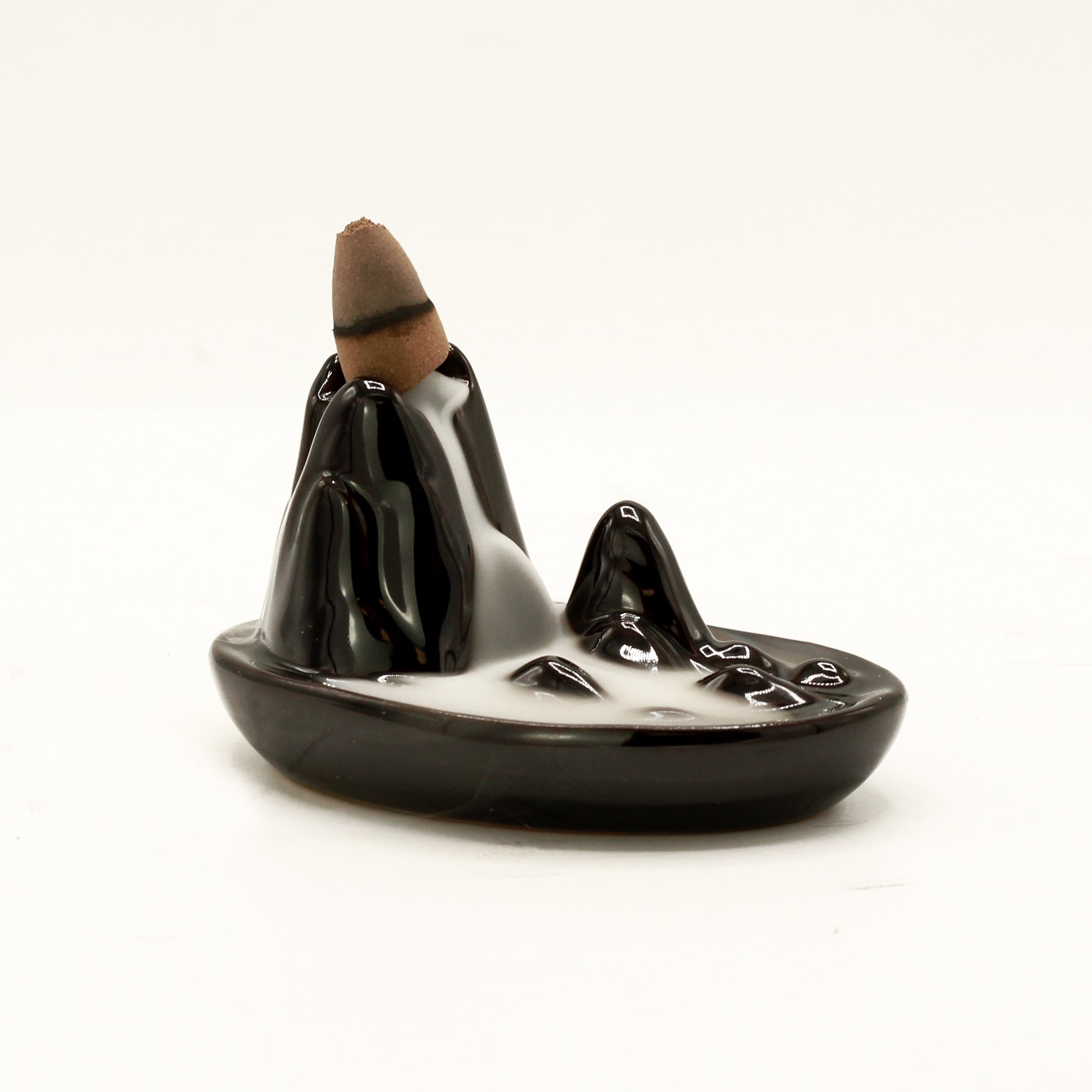 Transform your home into a tranquil haven with a backflow incense burner Mini Mountain. Designed to work with backflow incense cones. 
