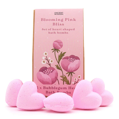 Pink heart-shaped bath bombs with a 'Blooming Pink Bliss' packaging on a white background