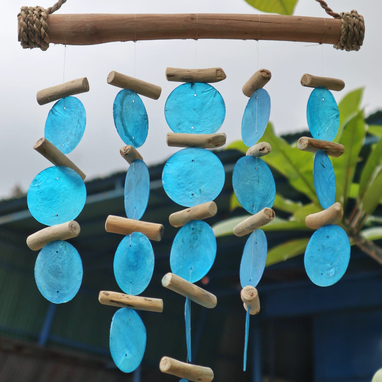 Bring a touch of natural elegance to your space with this handcrafted Blue Driftwood Chime,