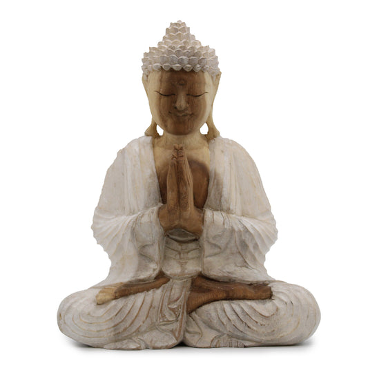 Hand Carved Buddha Statue Whitewash in Welcome Pose. Expertly crafted in Indonesia, each statue is meticulously carved by hand from sustainable Suar wood using traditional Balinese techniques.