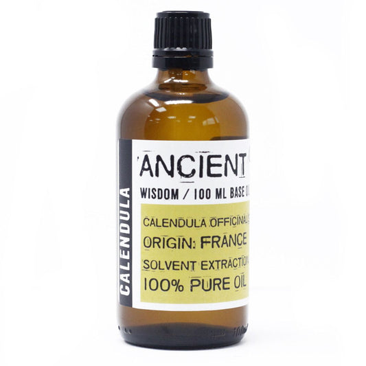 Bottle of calendula oil with a label on a white background