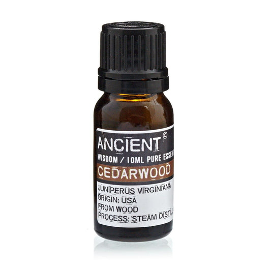 Bottle of Cedarwood essential oil with label on a white background