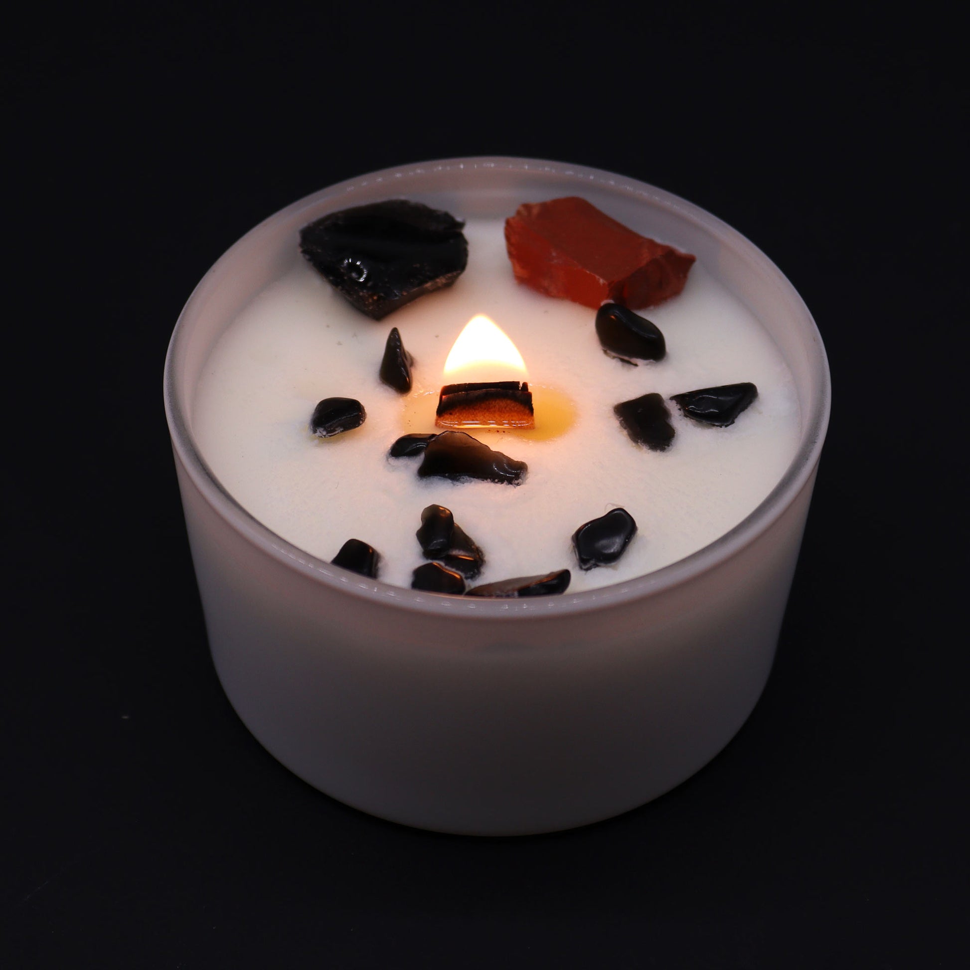 Unlock the power of your Root Chakra with this enchanting soy wax crystal candle. Embedded with Red Jasper & Black Agate, gemstones lit