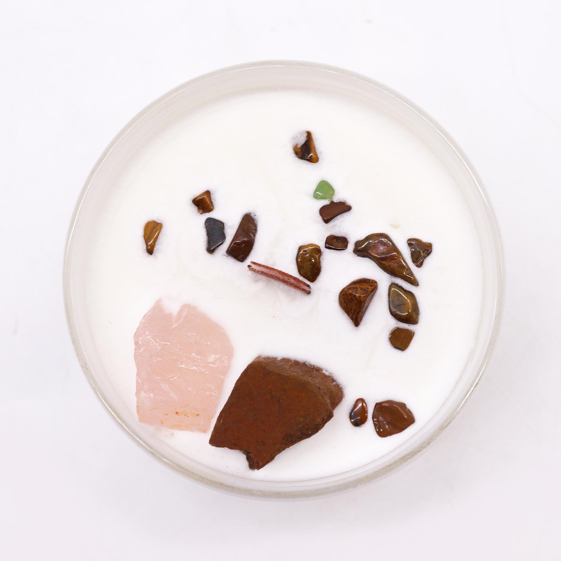 Unlock the power of your Sacred Sacral Chakra with this enchanting soy wax crystal candle. Embedded with Tiger Eye and Rose Quartz crystals, gemstones.
