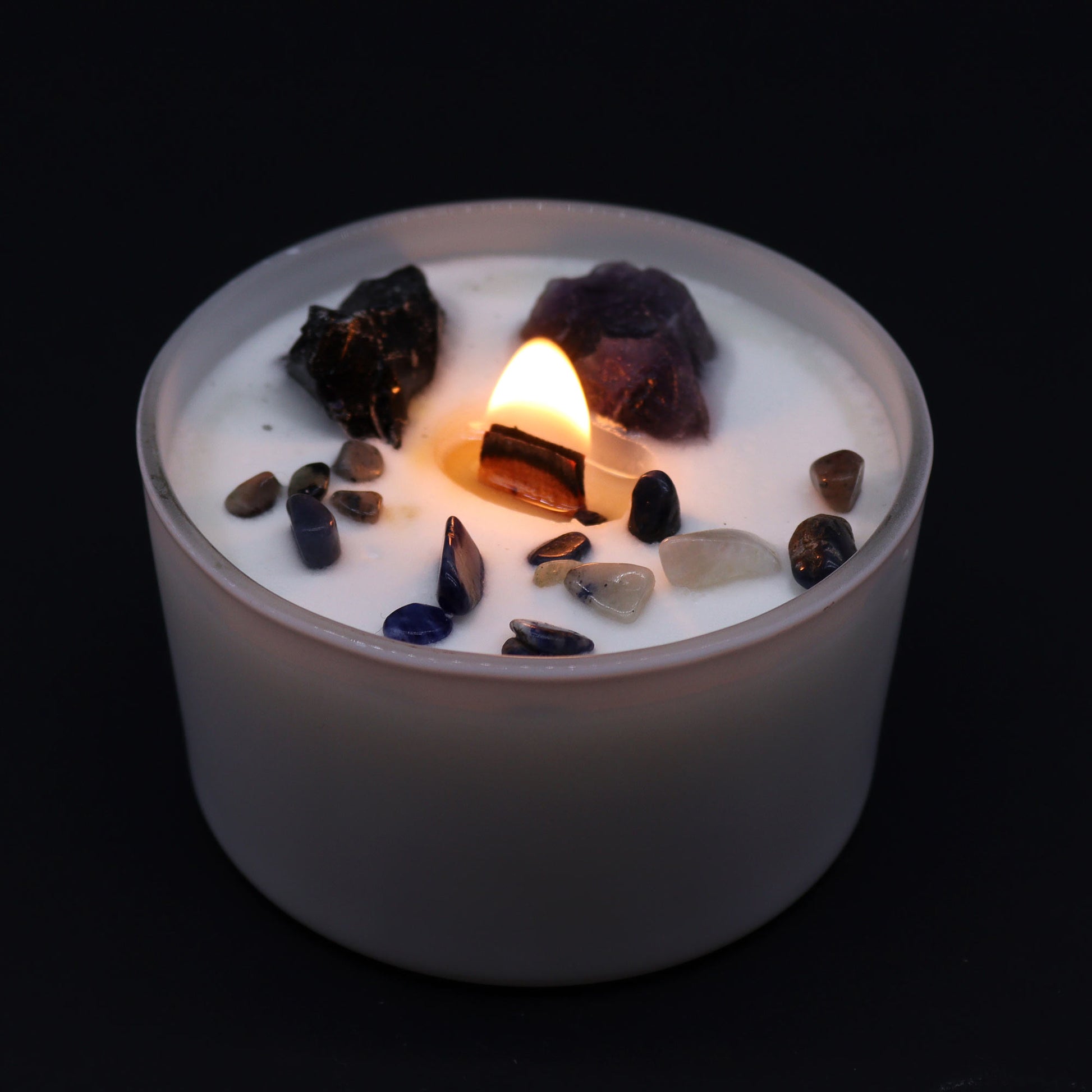 Unlock the power of your Solar Plexus Chakra with this enchanting soy wax crystal candle lit. Embedded with Amethyst and Black Agate crystal gemstones.