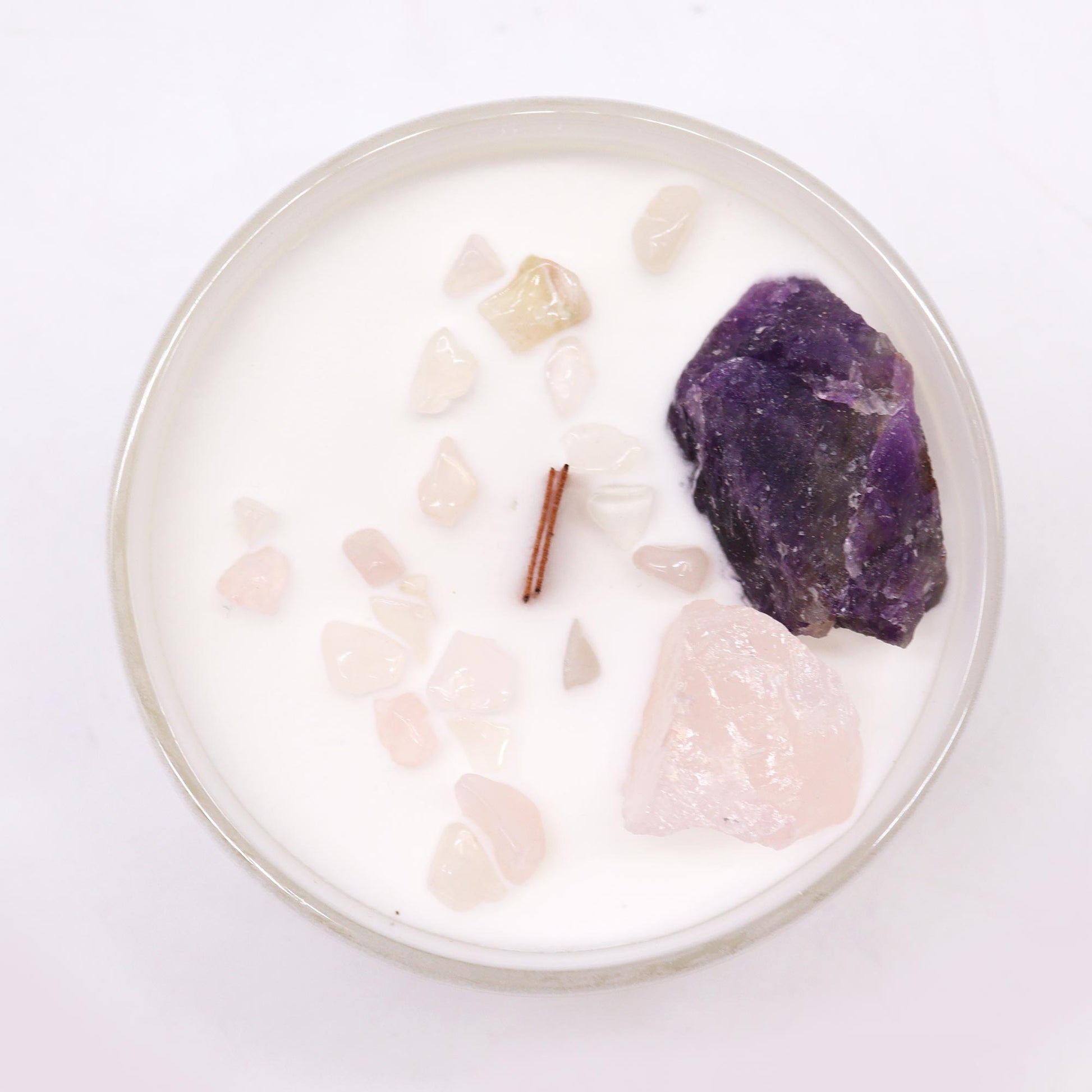 Third Eye Chakra with this enchanting soy wax crystal candle. Embedded with Amethyst and Rose Quartz crystals.