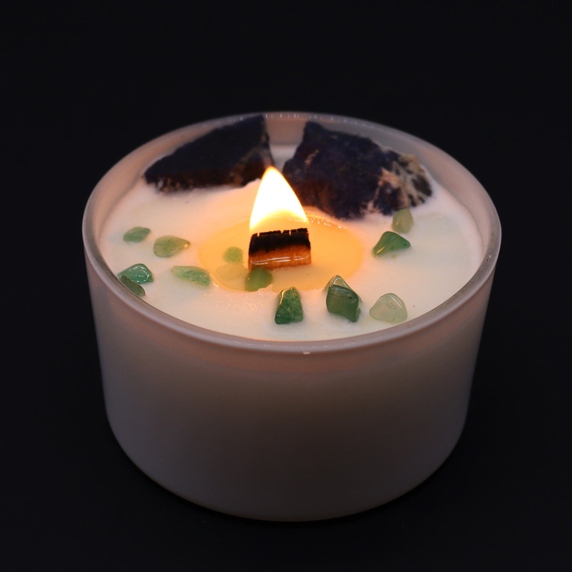 Unlock the power of your Throat Chakra with this enchanting soy wax crystal lit candle. Embedded with Sodalite and Jade Chips gemstones.