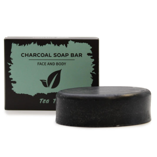 Black charcoal soap bar with packaging on a white background