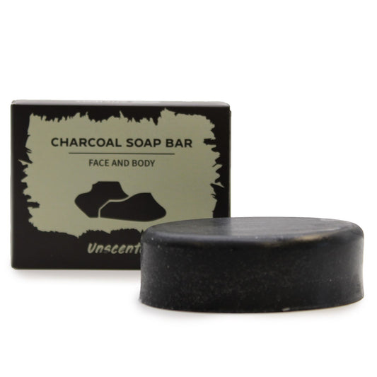Charcoal soap bar with packaging on a white background