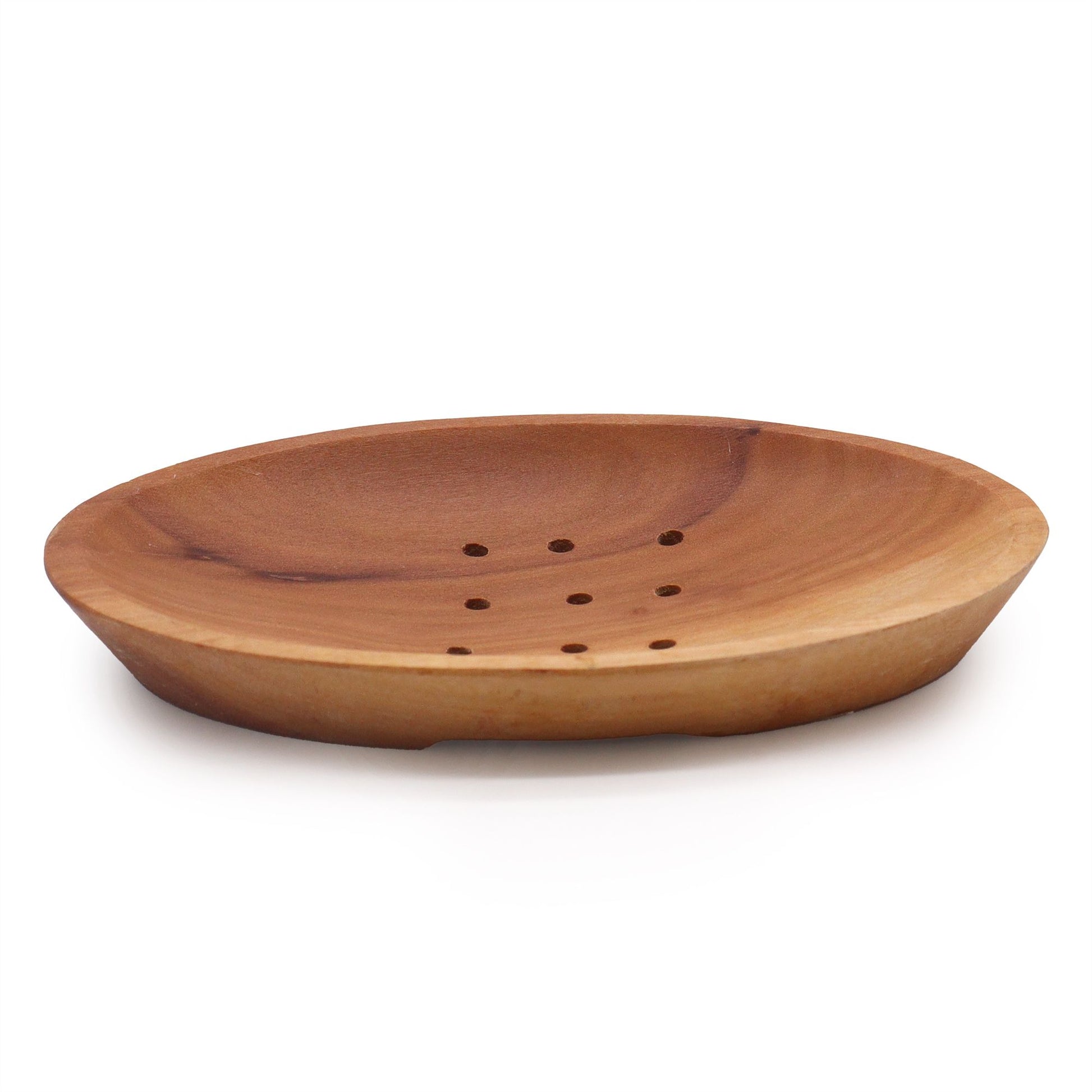 Wooden soap dish with holes on a white background