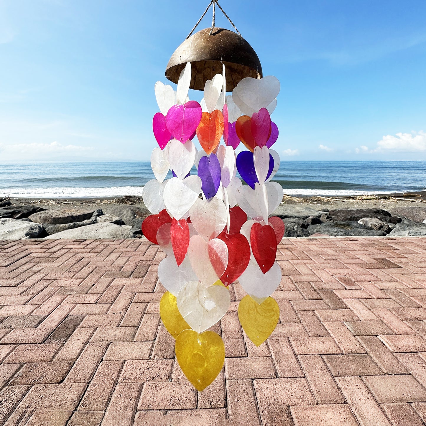 Add a splash of coastal charm to your home or garden with these beautiful Coconut &amp; Capiz Windchimes Big Hearts 