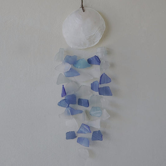 Bring harmony and a touch of nature to your outdoor space with a Recycled Glass Wind Chime Blue & White Glass. 
