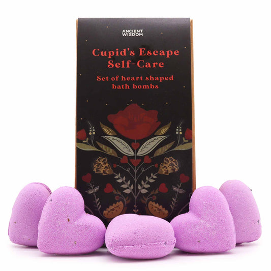 Set of heart-shaped purple bath bombs with a decorative box labeled 'Cupid's Escape Self-Care' on a white background.