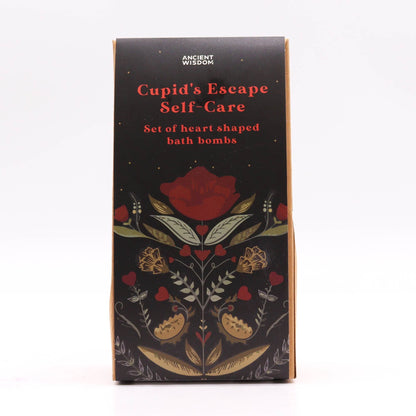Box of 'Cupid's Escape Self-Care' heart-shaped bath bombs with floral design on a white background