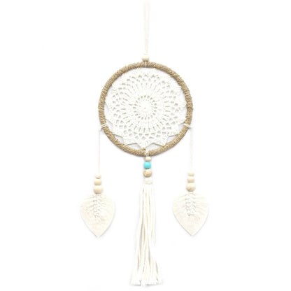 White dreamcatcher with beads on a white background