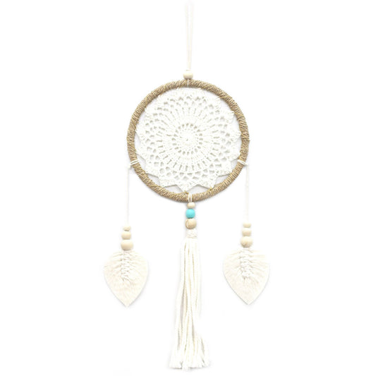 White dreamcatcher with beads on a white background