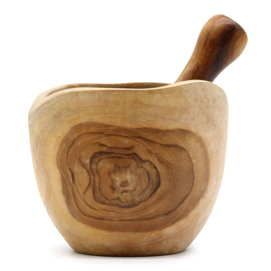 Wooden mortar and pestle on a white background