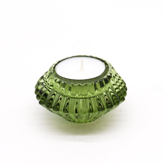 Add a touch of versatility and elegance to your home with the Flip Dinner Candle / Tealight Holder in Garden Jade. Expertly crafted from high-quality glass