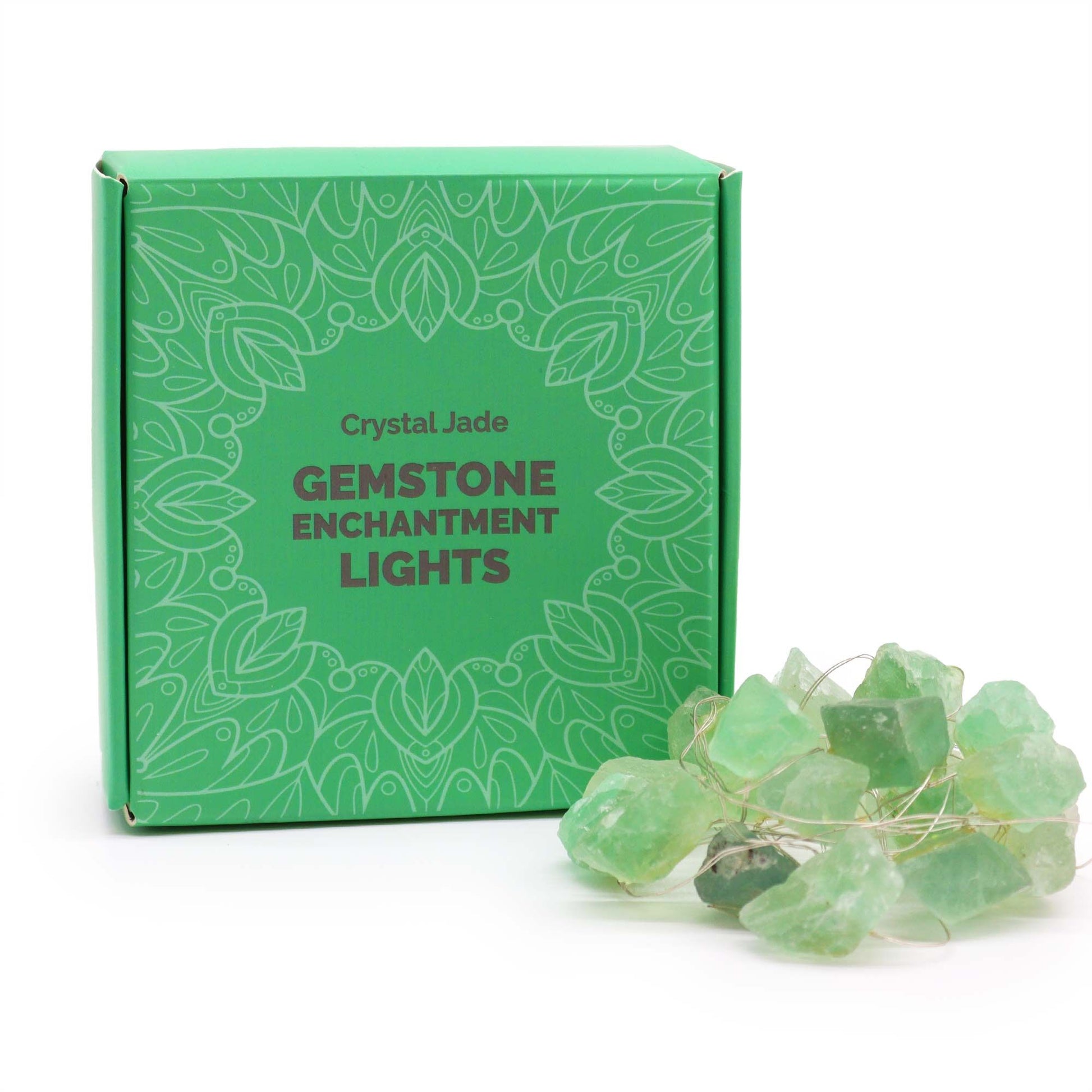 Green gemstone enchantment lights with packaging on a white background