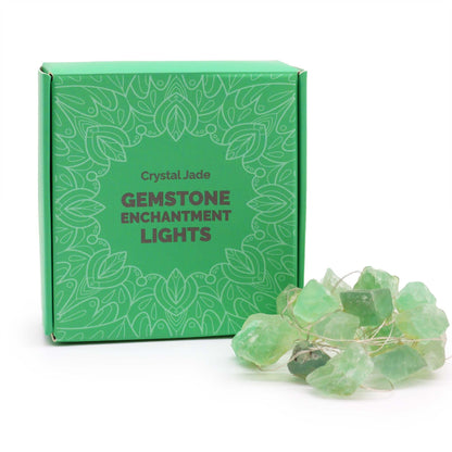 Green gemstone enchantment lights with packaging on a white background