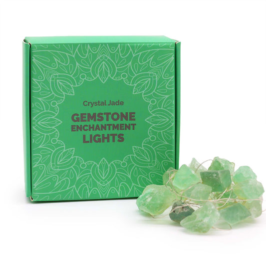 Green gemstone enchantment lights with packaging on a white background