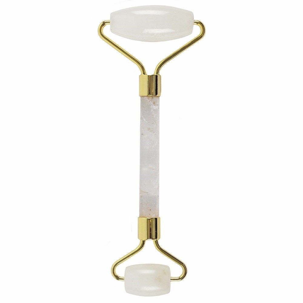 Facial roller with gold accents and white roller heads on a white background