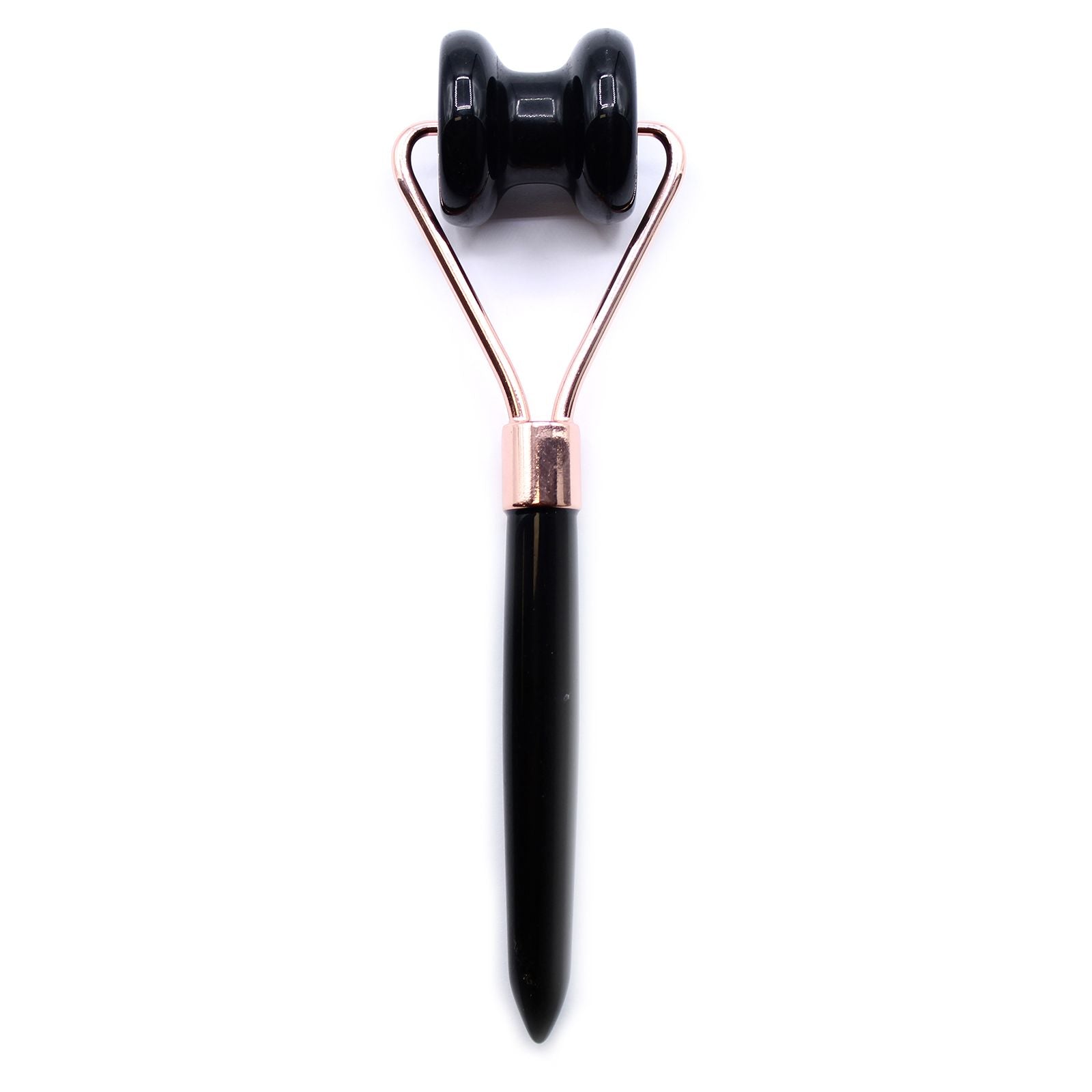 Black and rose gold facial roller on a white background