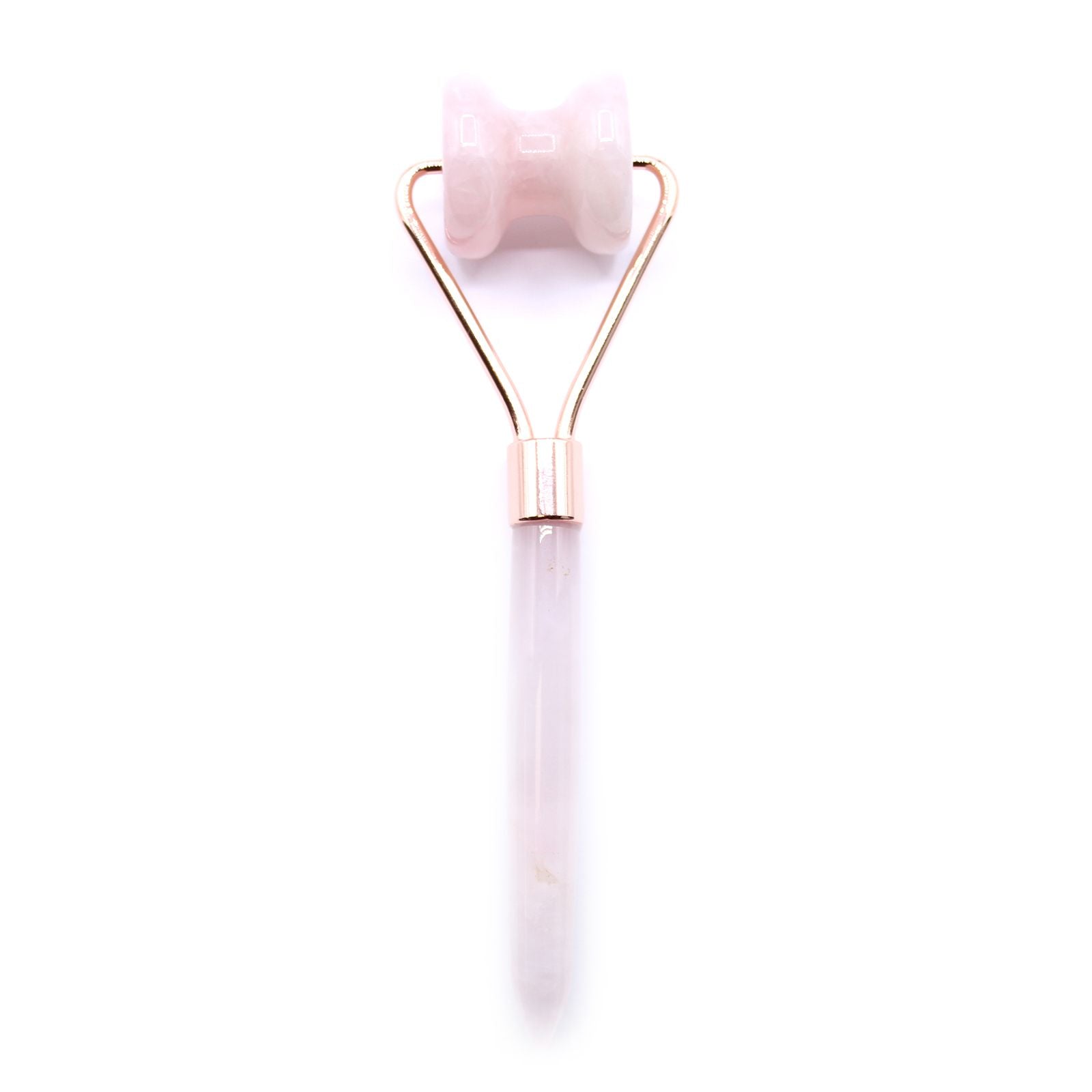 Rose gold and white facial roller on a white background