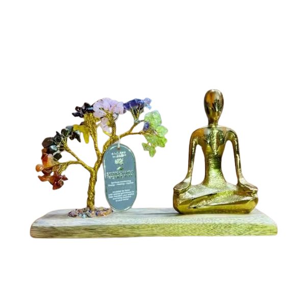 Decorative set with a tree and a meditating figure on a white background