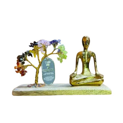 Decorative set with a tree and a meditating figure on a white background