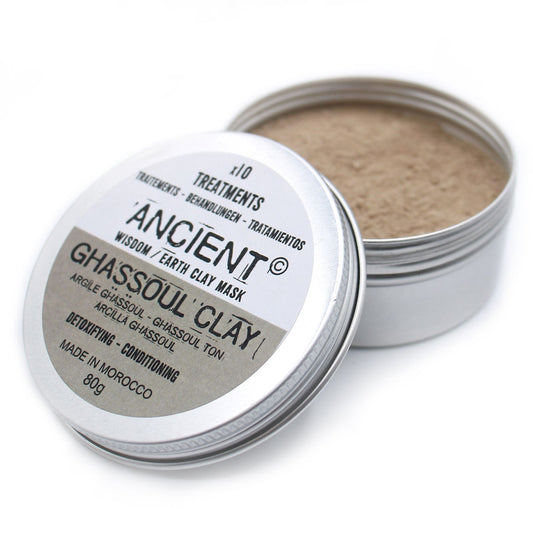 Open container of Ghassoul Clay mask with visible label on a white background