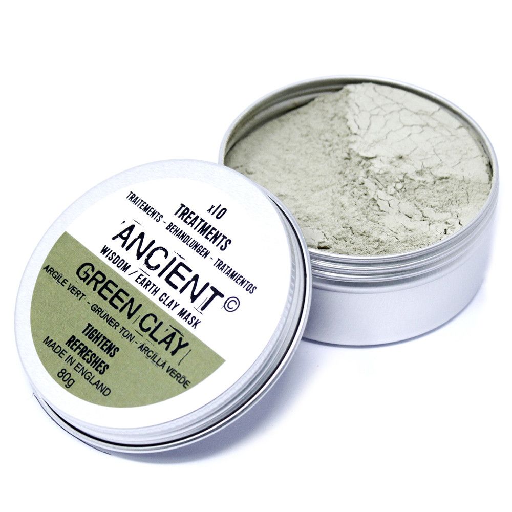 Open container of Ancient Green Clay with visible green clay powder inside on a white background