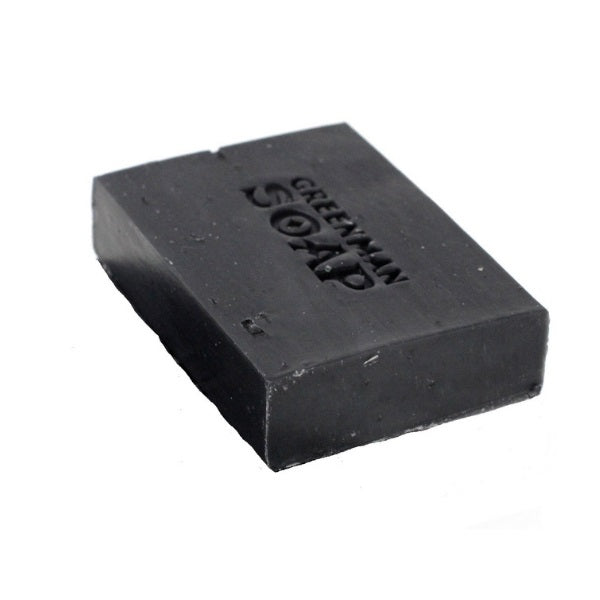 Black soap bar with 'Greenman Soap' branding on a white background