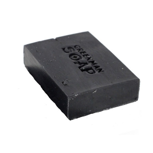 Black soap bar with 'Greenman Soap' branding on a white background