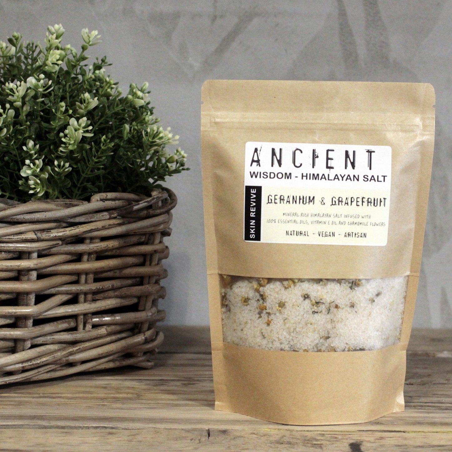 Kraft paper packaging of Himalayan salt with a plant in the background