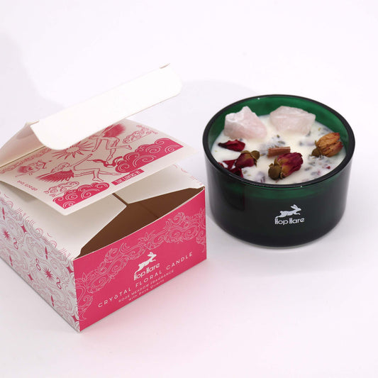 Hop Hare Crystal Magic Flower Candle The Lovers is housed in a striking dark green jar. This enchanting candle features and crackling wooden wick with a hidden tarot card inside, adding a touch of magic to your ritual.