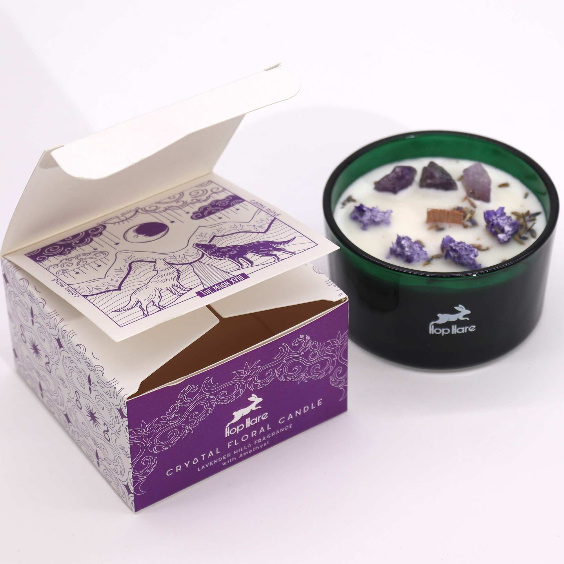 Housed in a striking dark green jar, the Hop Hare Crystal Magic Flower Candle boxed The Moon is an enchanting addition to your ritual space. 