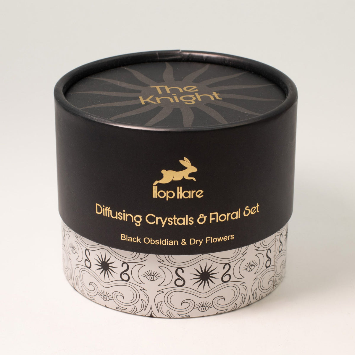 Black cylindrical container with 'The Knight' branding and decorative design on a white background